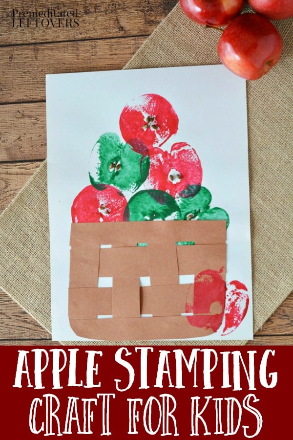 Red and Green apples stamped on white paper using a cut apple as the stamp. Brown paper weave basket is placed on the paper below the apples.